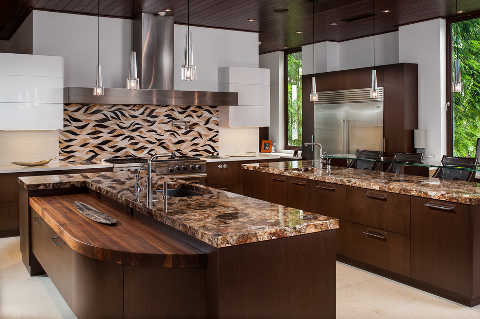 Inspiration for a large contemporary l-shaped open plan kitchen in Miami with an undermount sink, flat-panel cabinets, dark wood cabinets, multi-coloured splashback, stainless steel appliances, quartz benchtops, ceramic splashback, cement tiles, multiple islands and beige floor.
