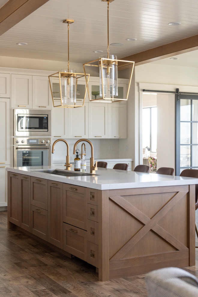 Inspiration for a large country eat-in kitchen in Salt Lake City with white cabinets and with island.