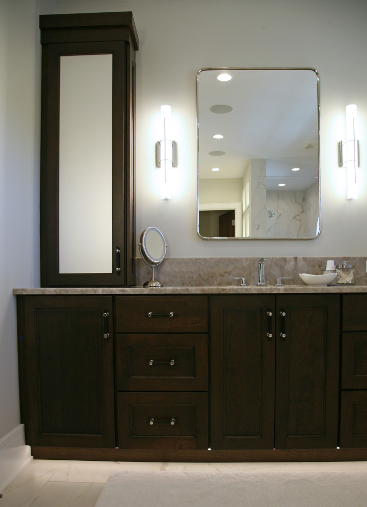 Photo of a mid-sized contemporary master bathroom in Milwaukee with flat-panel cabinets, dark wood cabinets, a freestanding tub, an open shower, a one-piece toilet, brown tile, ceramic tile, beige walls, ceramic floors, an undermount sink, quartzite benchtops, beige floor, an open shower, white benchtops, an enclosed toilet, a double vanity, a built-in vanity and vaulted.