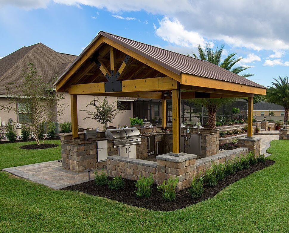 Inspiration for a mid-sized traditional backyard patio in Tampa with an outdoor kitchen, concrete pavers and a gazebo/cabana.