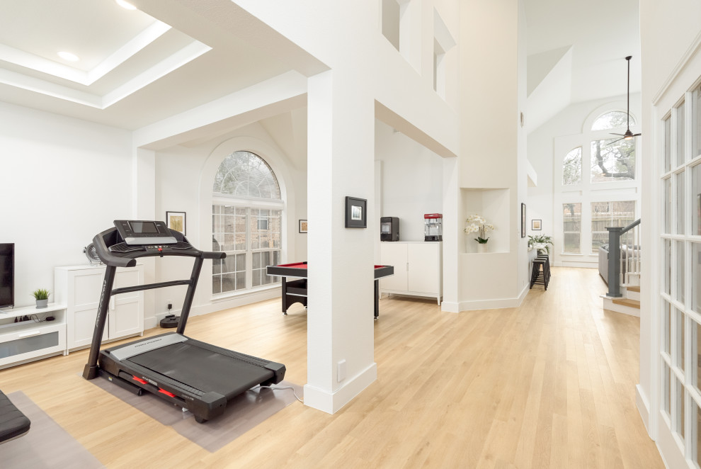 Large 1960s vinyl floor, beige floor and coffered ceiling multiuse home gym photo in Austin with white walls