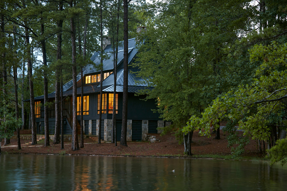 Large rustic black two-story wood gable roof idea in Birmingham with a metal roof