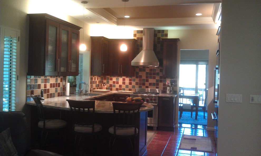 Kitchen pantry - mid-sized contemporary u-shaped terra-cotta tile and brown floor kitchen pantry idea in San Francisco with a double-bowl sink, shaker cabinets, dark wood cabinets, granite countertops, multicolored backsplash, glass tile backsplash, stainless steel appliances and a peninsula