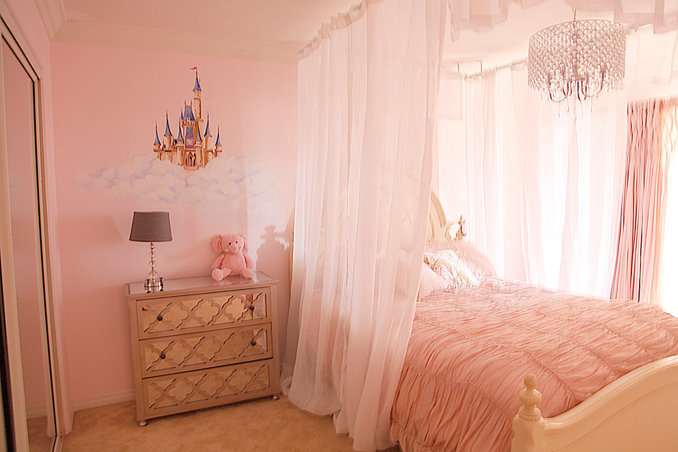 Design ideas for a mid-sized traditional kids' bedroom for kids 4-10 years old and girls in Los Angeles with pink walls and carpet.