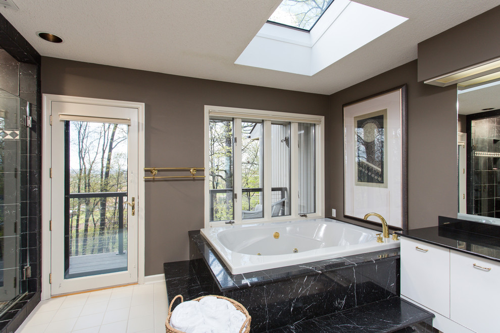 Large contemporary master bathroom in Other with flat-panel cabinets, white cabinets, granite benchtops, a corner tub, an alcove shower, white tile, grey walls and ceramic floors.