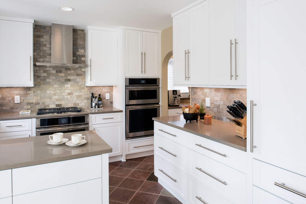 Inspiration for a mid-sized modern u-shaped separate kitchen in DC Metro with an undermount sink, shaker cabinets, white cabinets, quartz benchtops, multi-coloured splashback, marble splashback, stainless steel appliances, slate floors, a peninsula and multi-coloured floor.