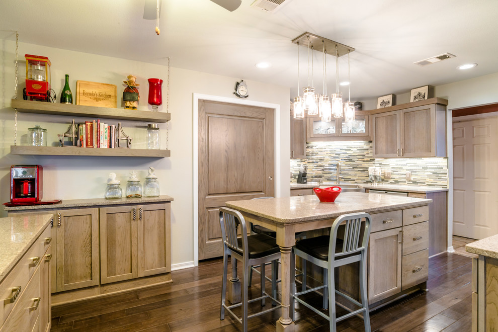Mid-sized transitional u-shaped medium tone wood floor enclosed kitchen photo in Miami with a farmhouse sink, shaker cabinets, gray cabinets, quartz countertops, gray backsplash, glass tile backsplash, white appliances and an island