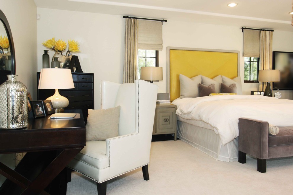 Photo of a contemporary bedroom in Orange County with beige walls, carpet and beige floor.