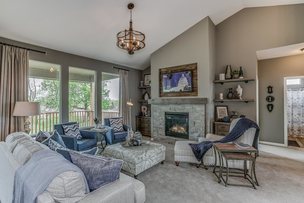 This is an example of a mid-sized traditional formal open concept living room in Wichita with grey walls, dark hardwood floors, a standard fireplace, a stone fireplace surround and a wall-mounted tv.