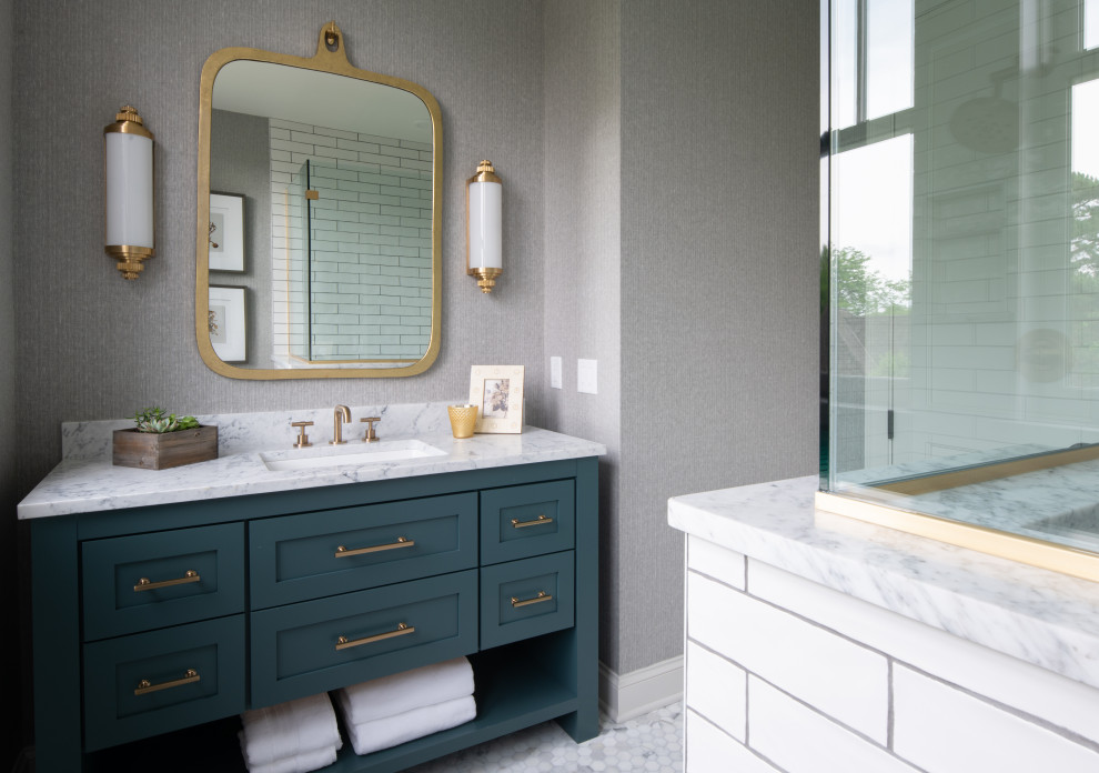 Example of a mid-sized transitional master white tile and subway tile mosaic tile floor, gray floor, single-sink and wallpaper bathroom design in Minneapolis with shaker cabinets, blue cabinets, gray walls, an undermount sink, quartz countertops, gray countertops and a freestanding vanity