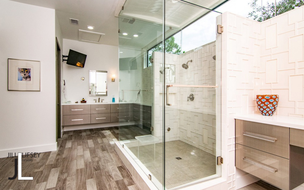 This is an example of a mid-sized modern master wet room bathroom in Tampa with flat-panel cabinets, grey cabinets, a two-piece toilet, white tile, ceramic tile, white walls, medium hardwood floors, an undermount sink, engineered quartz benchtops, grey floor, a hinged shower door, white benchtops, a niche, a double vanity and a floating vanity.