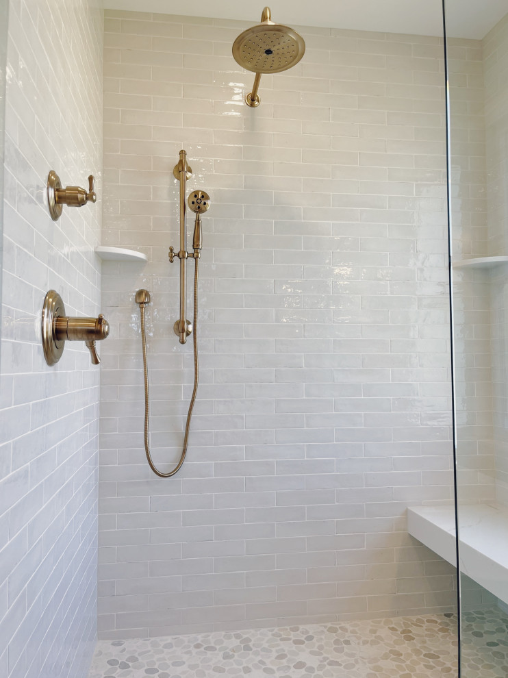 Example of a large transitional master white tile and ceramic tile travertine floor, beige floor and double-sink freestanding bathtub design with shaker cabinets, white cabinets, a two-piece toilet, beige walls, an undermount sink, quartz countertops, a hinged shower door, white countertops and a built-in vanity