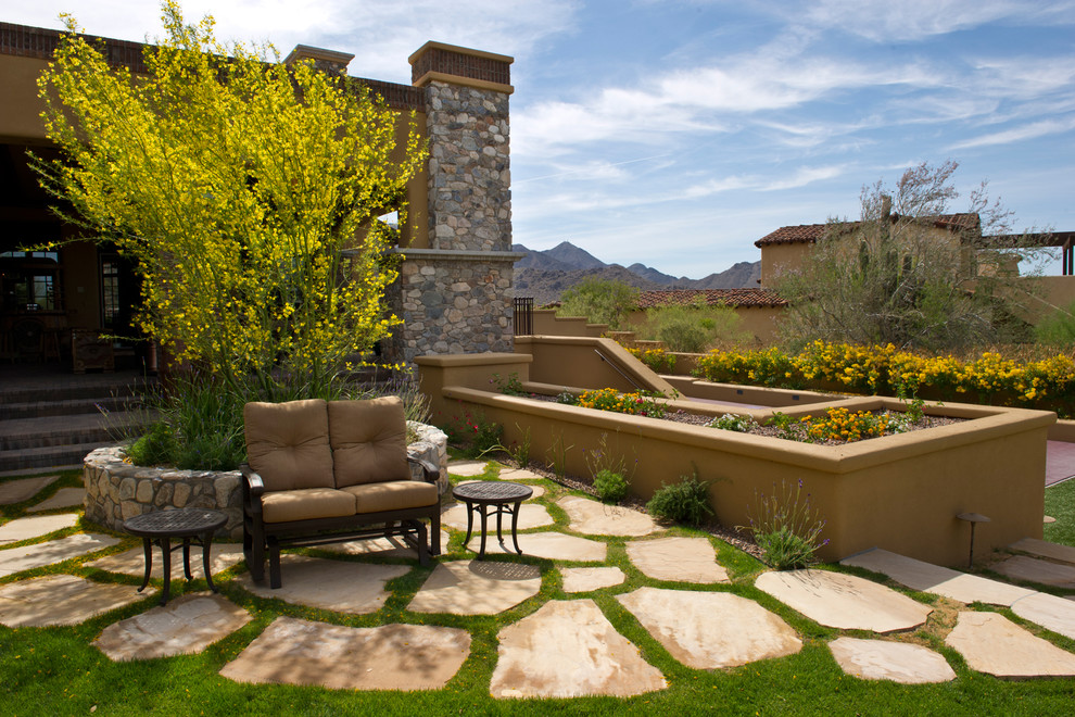 Inspiration for a large rustic full sun backyard stone garden path in Phoenix for fall.