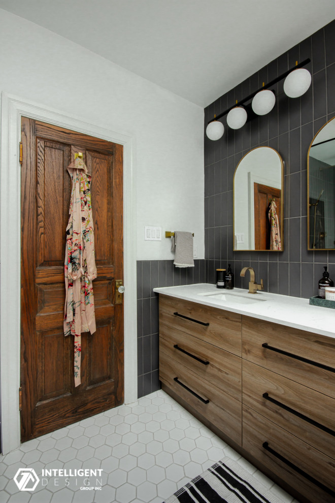 This is an example of a large scandinavian master bathroom in Toronto with flat-panel cabinets, medium wood cabinets, a corner shower, a one-piece toilet, gray tile, porcelain tile, white walls, mosaic tile floors, an undermount sink, engineered quartz benchtops, white floor, a hinged shower door, white benchtops, a double vanity and a built-in vanity.
