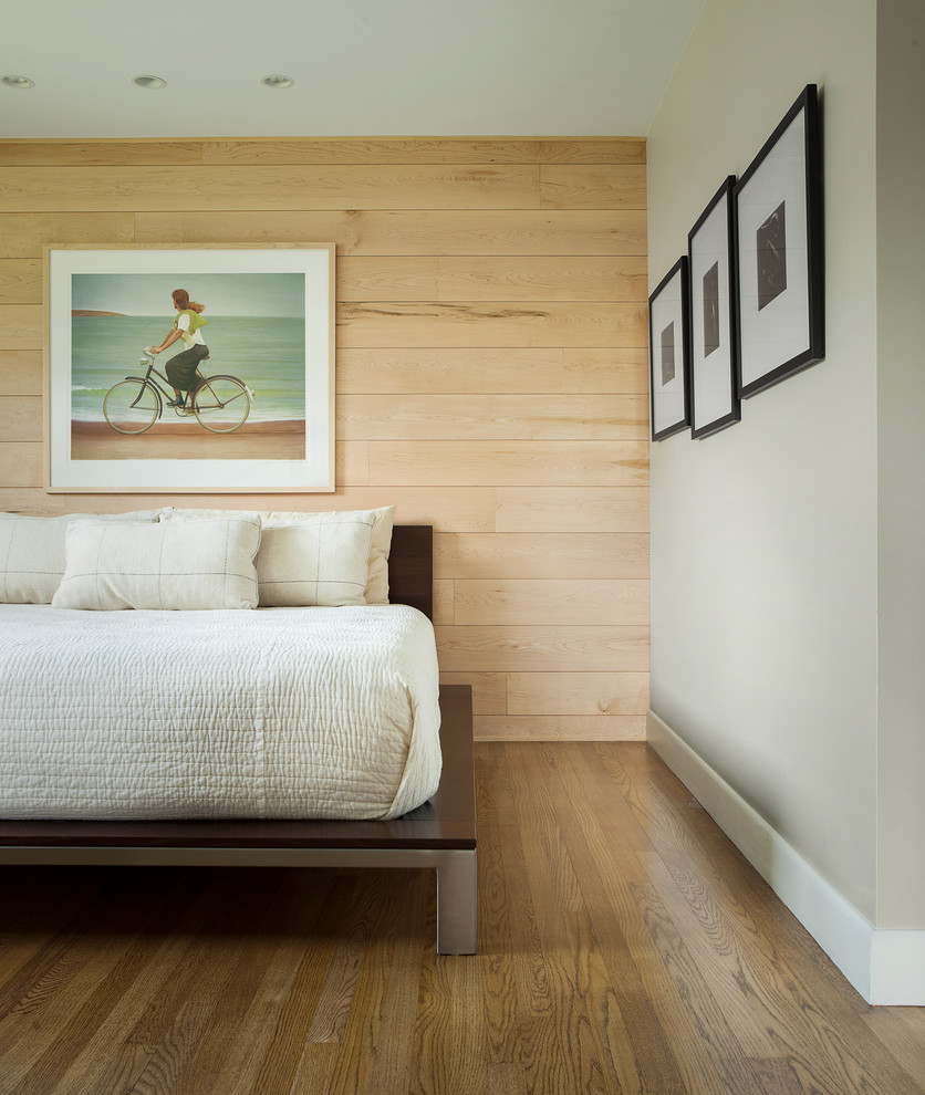 This is an example of a contemporary bedroom in Portland Maine with grey walls, marble floors and brown floor.