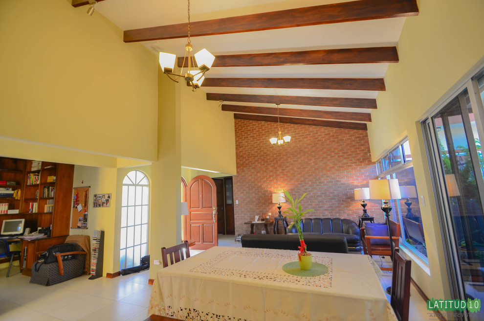 Home design - small rustic porcelain tile home design idea with yellow walls and no fireplace