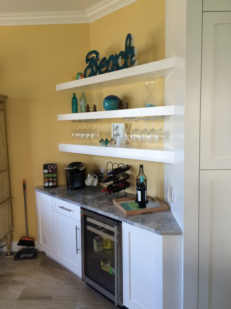 This is an example of a beach style home bar in Miami.