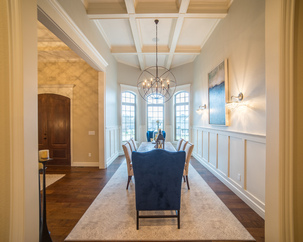Inspiration for a large transitional dark wood floor dining room remodel with beige walls and no fireplace
