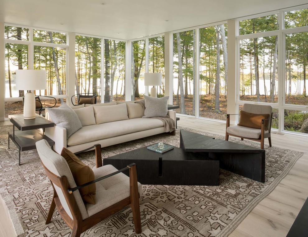 Inspiration for a modern sunroom in Portland Maine with light hardwood floors, a standard ceiling and beige floor.