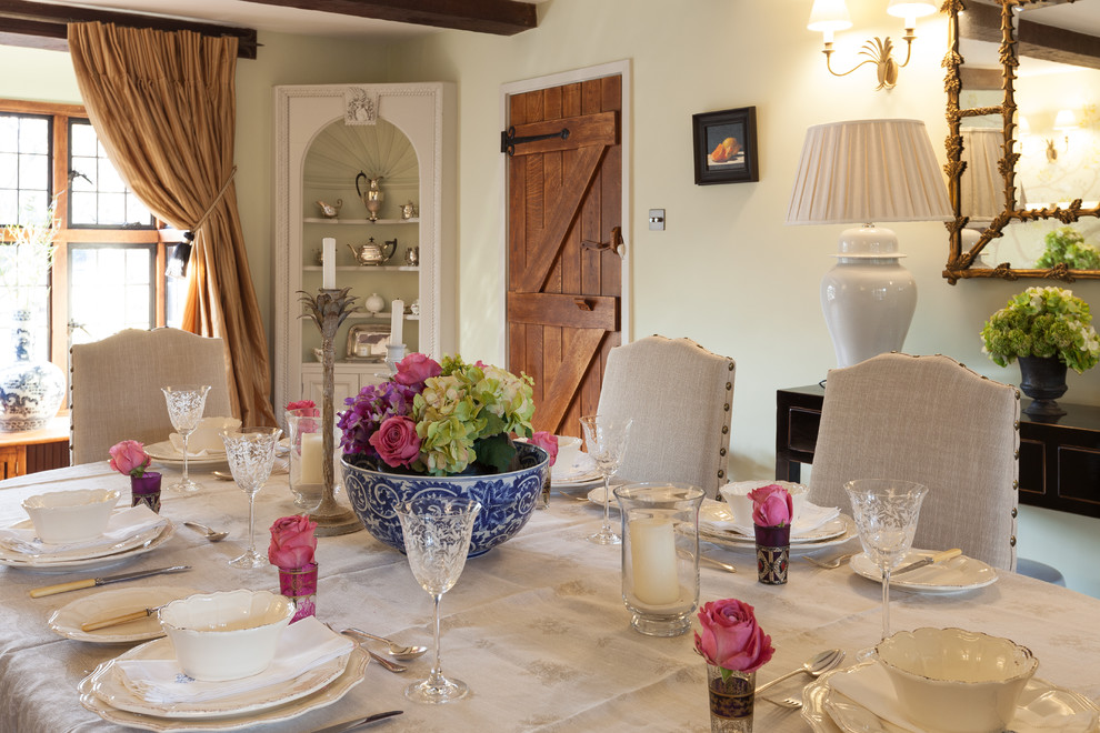 Photo of a mid-sized country separate dining room in Surrey with white walls.