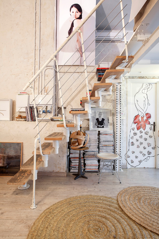 Photo of a small eclectic wood straight staircase in Madrid with open risers.