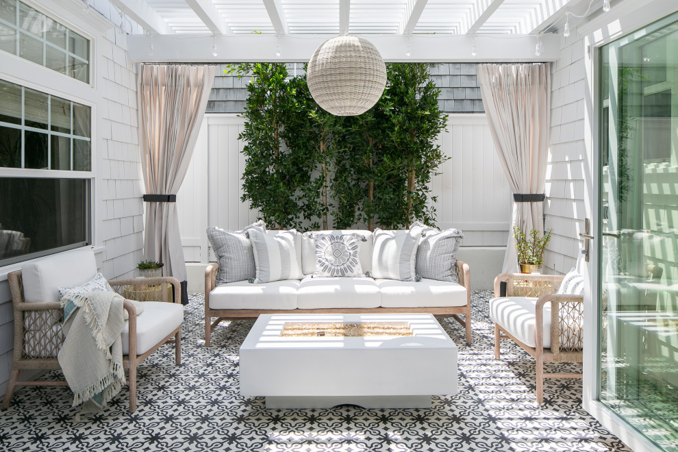 Inspiration for a transitional backyard patio in Los Angeles with a pergola.