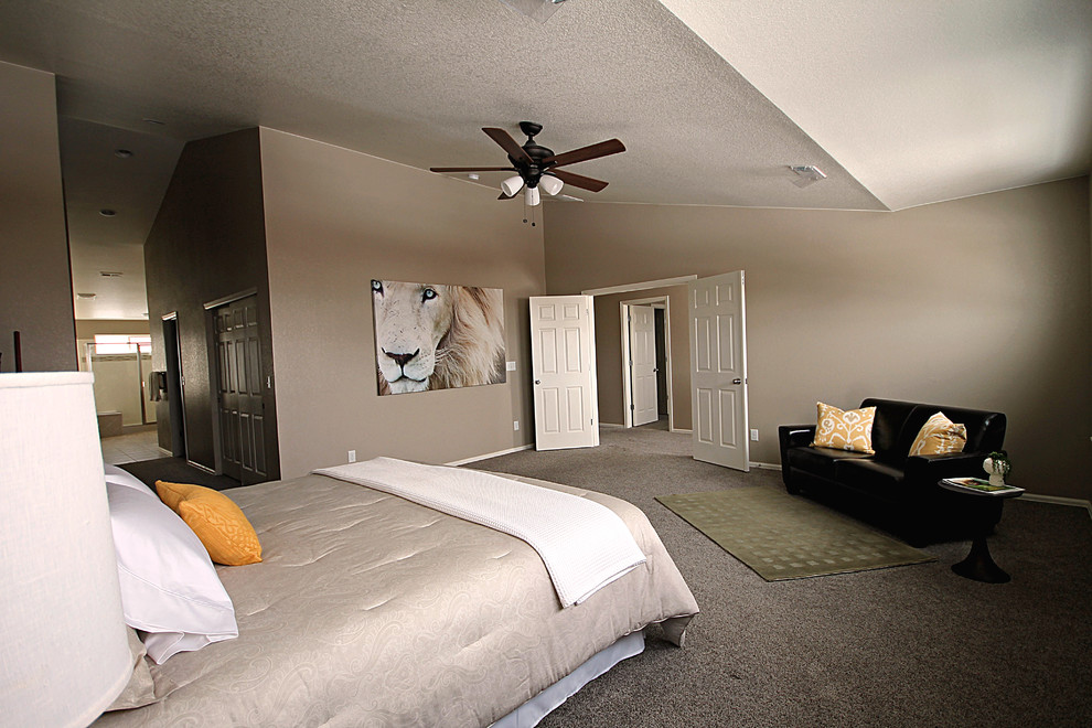 This is an example of a mid-sized contemporary master bedroom in Denver with beige walls, carpet and beige floor.