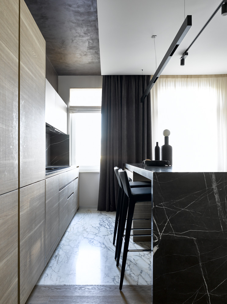 Inspiration for a contemporary single-wall open plan kitchen in Moscow with an undermount sink, flat-panel cabinets, medium wood cabinets, marble benchtops, grey splashback, marble splashback, black appliances, marble floors, with island, white floor and grey benchtop.