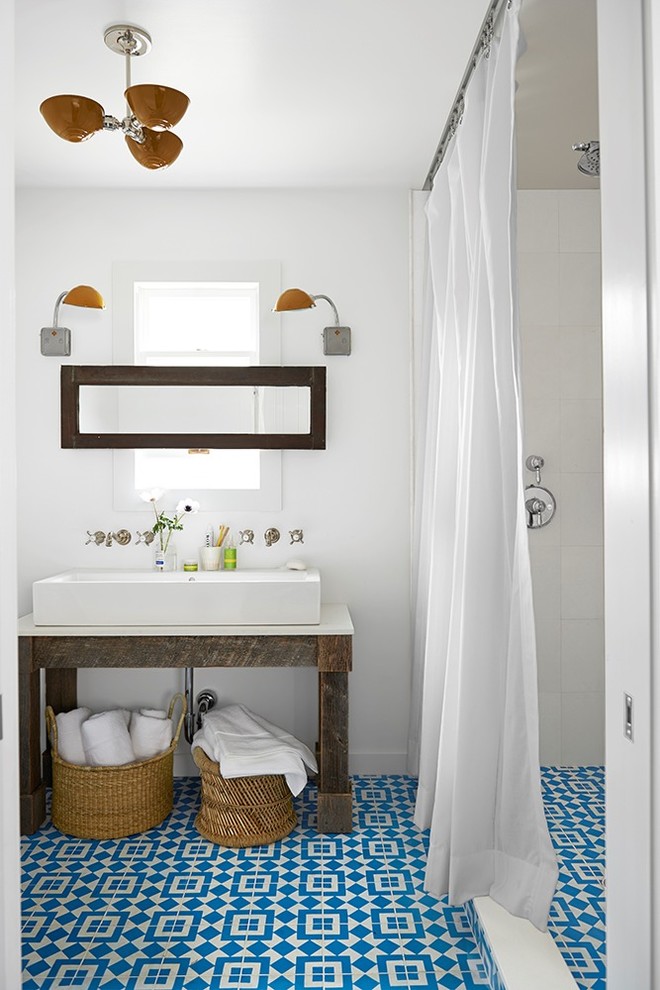 Small beach style 3/4 bathroom in New York with distressed cabinets, white tile, porcelain tile, white walls, cement tiles, a vessel sink, engineered quartz benchtops, blue floor, a shower curtain, white benchtops and an alcove shower.