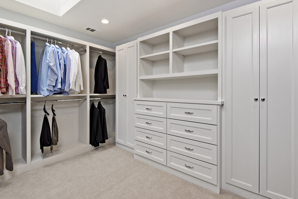 This is an example of a mid-sized transitional storage and wardrobe in Dallas with recessed-panel cabinets, white cabinets and porcelain floors.