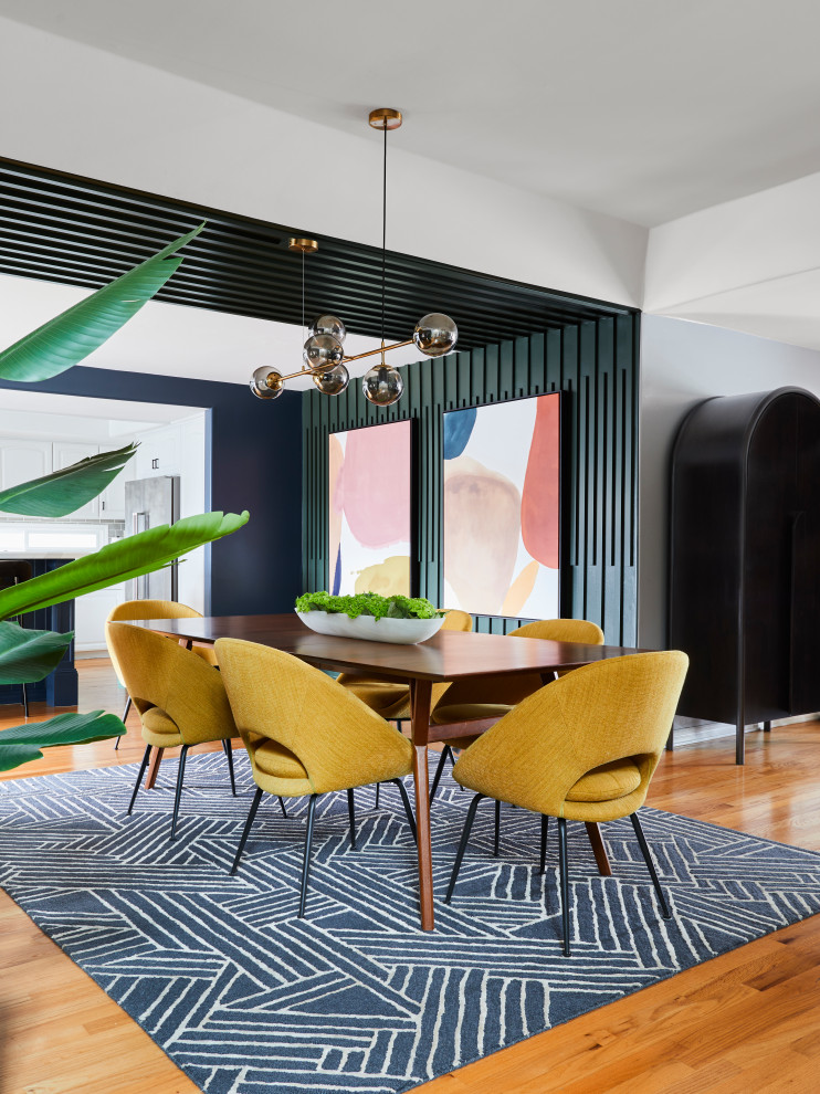 Small 1960s vinyl floor, beige floor, wood ceiling and wall paneling great room photo in Los Angeles with green walls