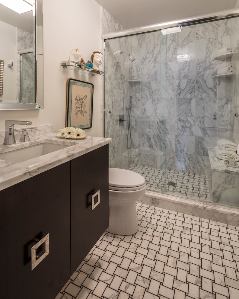 Design ideas for a mid-sized transitional master bathroom in New York with flat-panel cabinets, dark wood cabinets, an open shower, a two-piece toilet, stone tile, white walls, mosaic tile floors, an undermount sink and marble benchtops.