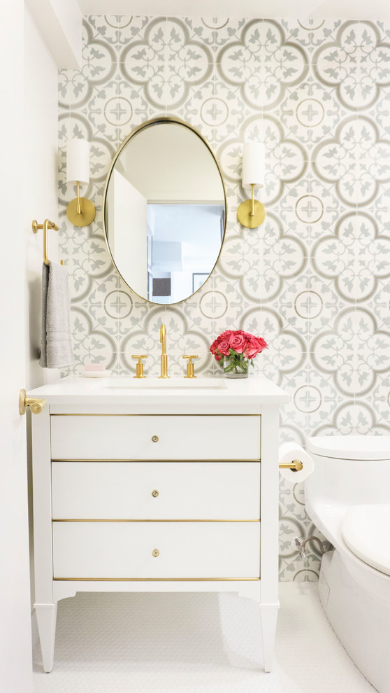 Photo of a small transitional powder room in Chicago with flat-panel cabinets, white cabinets, a one-piece toilet, white tile, cement tile, white walls, porcelain floors, an undermount sink, engineered quartz benchtops, white floor and white benchtops.