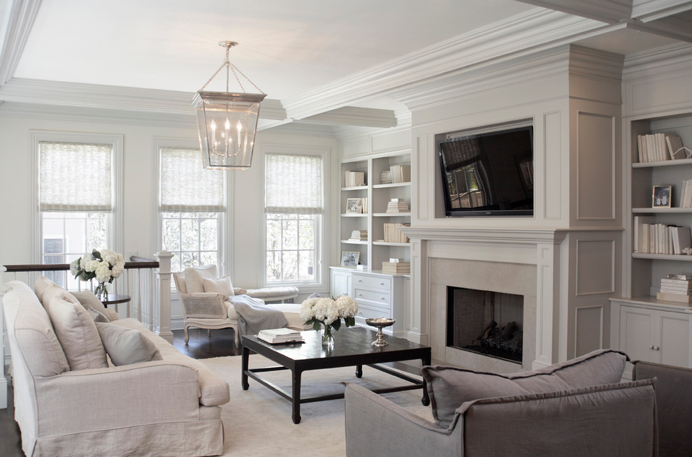 Inspiration for a transitional family room in Chicago with white walls.