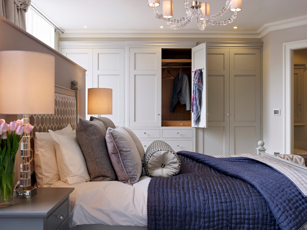 Transitional master bedroom in Gloucestershire with no fireplace.