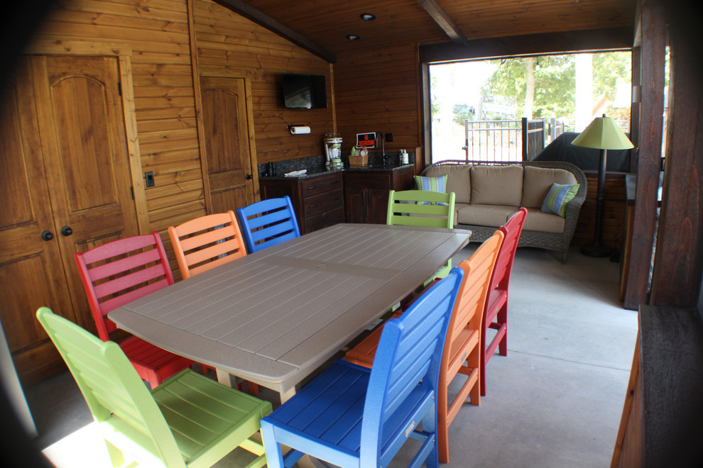 Large transitional backyard concrete patio kitchen photo with a gazebo