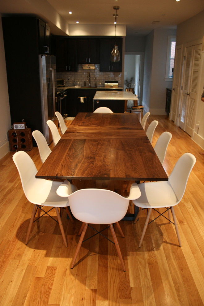 Kitchen/dining room combo - mid-sized transitional medium tone wood floor and beige floor kitchen/dining room combo idea in DC Metro with white walls and no fireplace