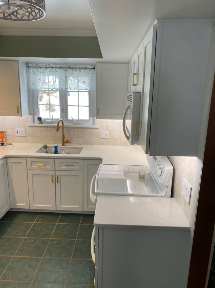 Enclosed kitchen - mid-sized transitional u-shaped enclosed kitchen idea with shaker cabinets, white cabinets and quartz countertops