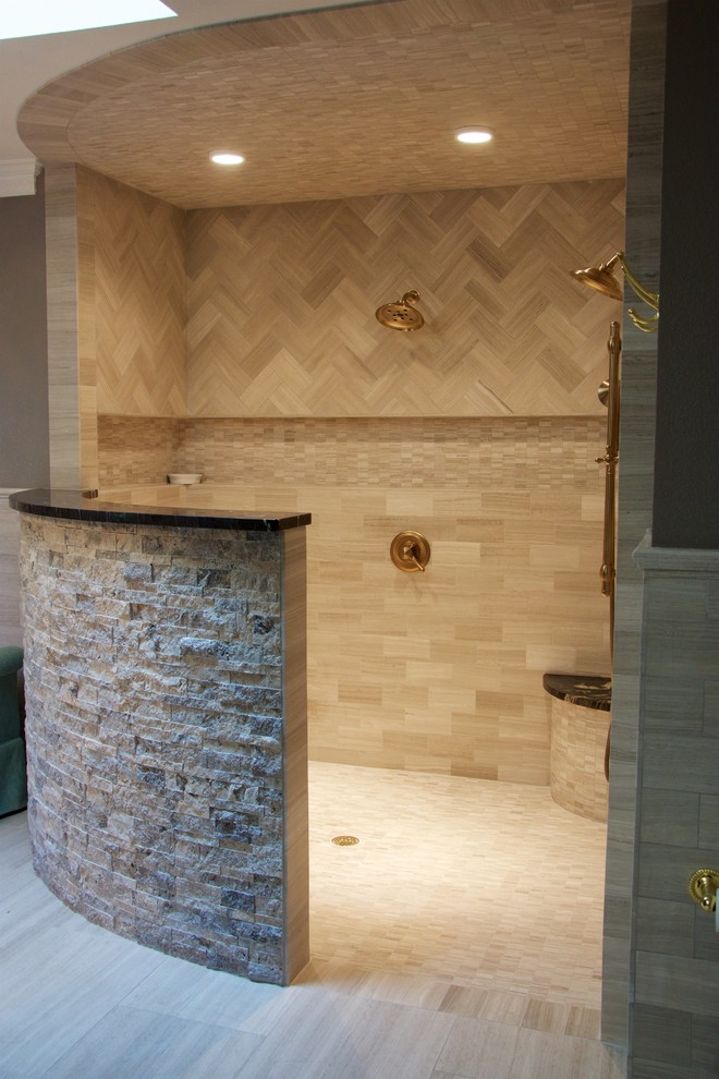 Inspiration for a large contemporary master bathroom in Austin with beaded inset cabinets, dark wood cabinets, a freestanding tub, an open shower, a bidet, beige tile, beige walls, ceramic floors, a drop-in sink and granite benchtops.