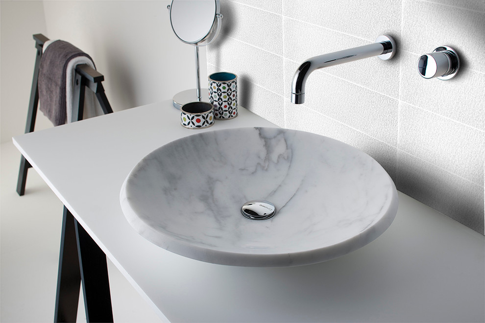 This is an example of a large contemporary bathroom in San Francisco with a vessel sink, open cabinets, black cabinets, marble benchtops, white tile, glass tile, white walls and concrete floors.