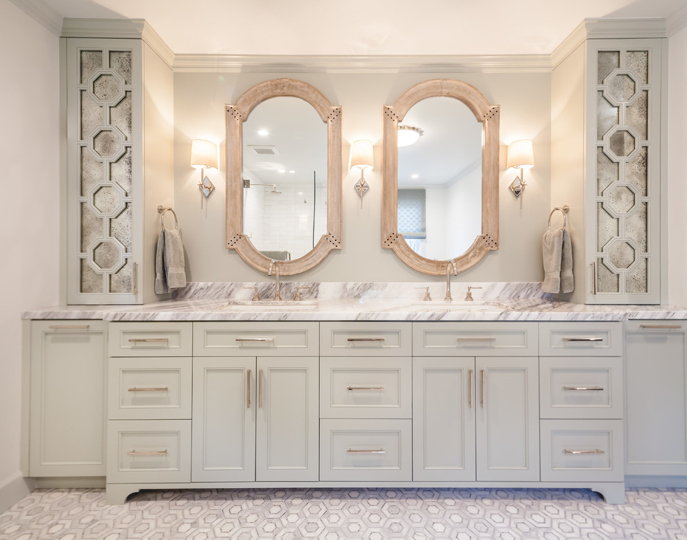 This is an example of a large eclectic master bathroom in San Francisco with recessed-panel cabinets, green cabinets, a freestanding tub, a corner shower, marble, grey walls, marble floors, an undermount sink, marble benchtops and a hinged shower door.