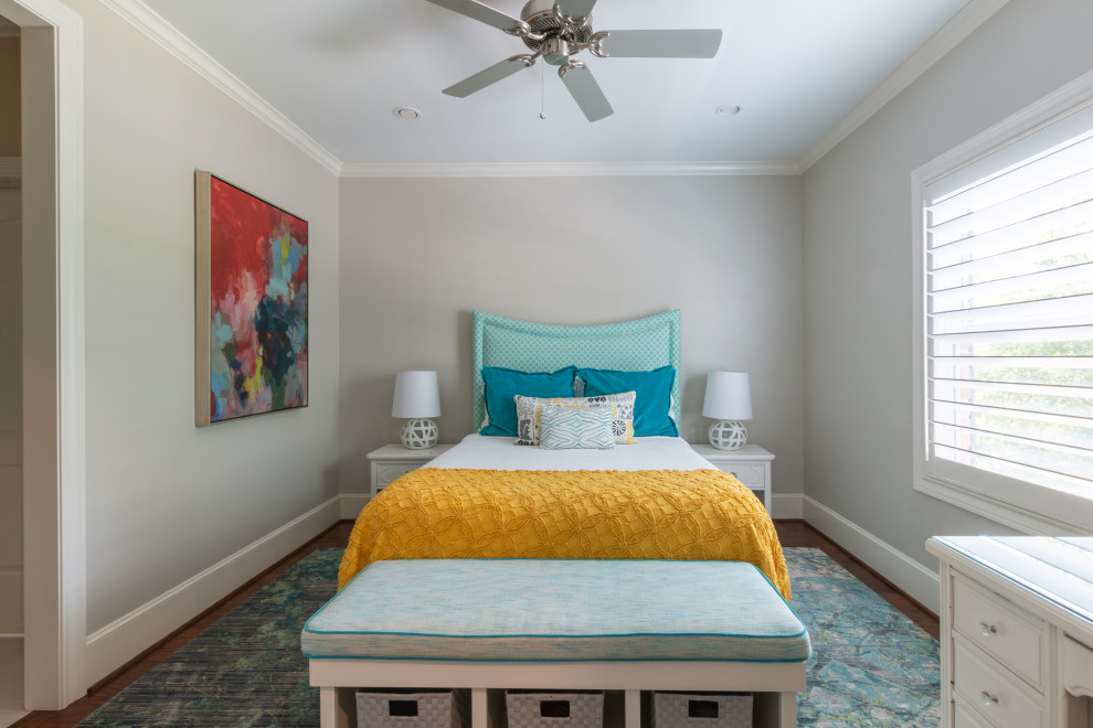 Mid-sized transitional kids' room in Houston with grey walls and medium hardwood floors for girls.