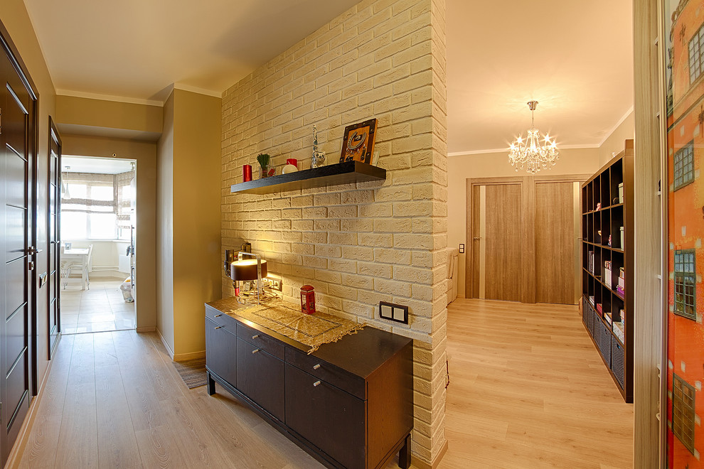 Mid-sized contemporary hallway in Moscow with beige walls and laminate floors.