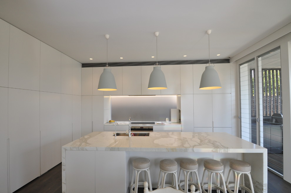 Inspiration for a mid-sized contemporary l-shaped open plan kitchen in Sydney with flat-panel cabinets, white cabinets, dark hardwood floors and with island.