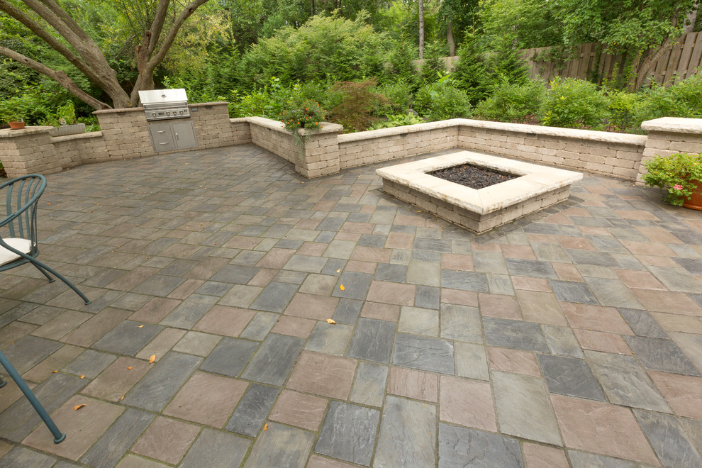 Design ideas for a mid-sized traditional backyard patio in Indianapolis with a fire feature, concrete pavers and no cover.