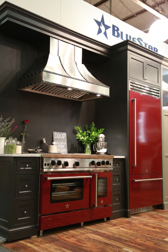 This is an example of a large country kitchen in New York with coloured appliances.