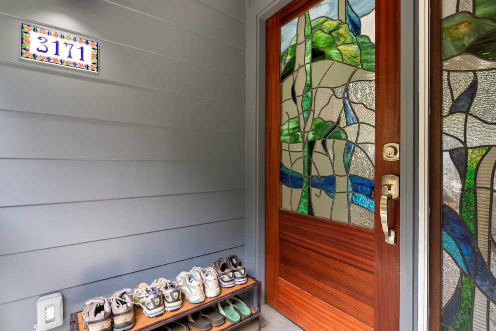 Design ideas for a mid-sized transitional front door in Hawaii with blue walls, painted wood floors, a single front door and a dark wood front door.