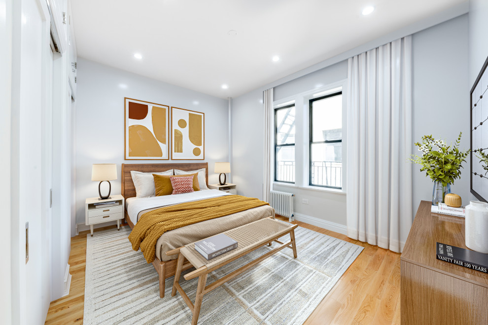 Design ideas for a small classic master bedroom in New York with grey walls.