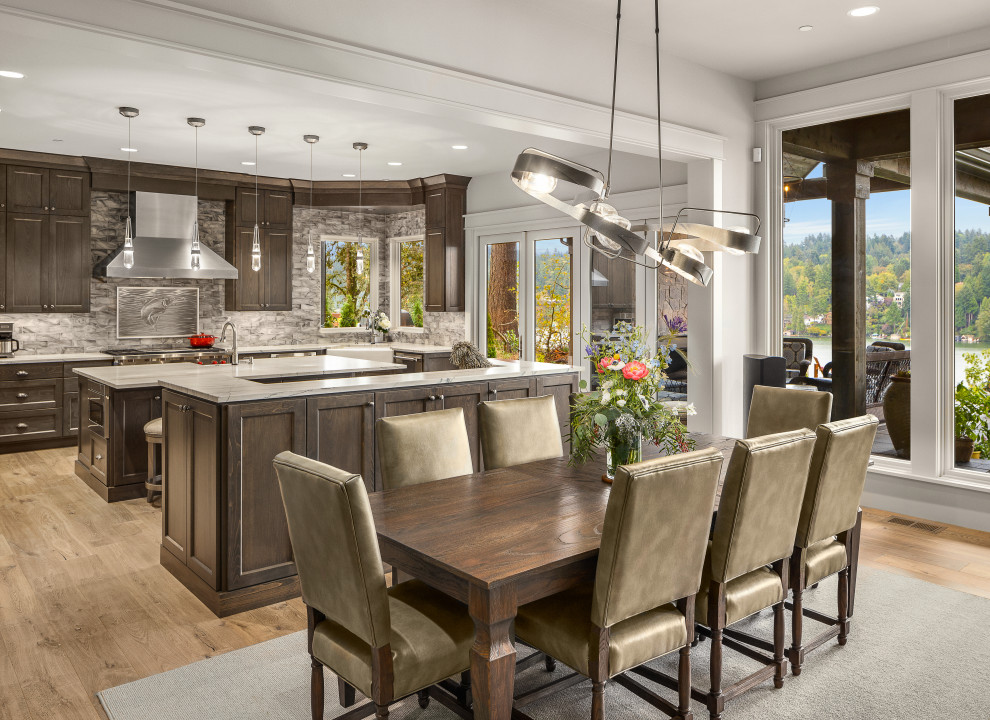Large transitional kitchen/dining combo in Portland with grey walls and light hardwood floors.