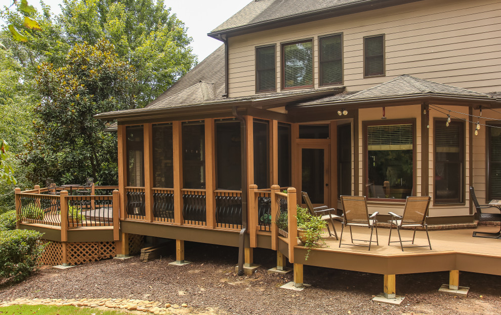 Large classic tile screened-in back porch idea in Atlanta with a roof extension